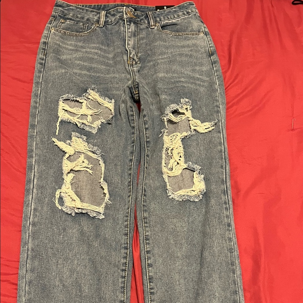 light wash straight leg mid rise ripped jeans